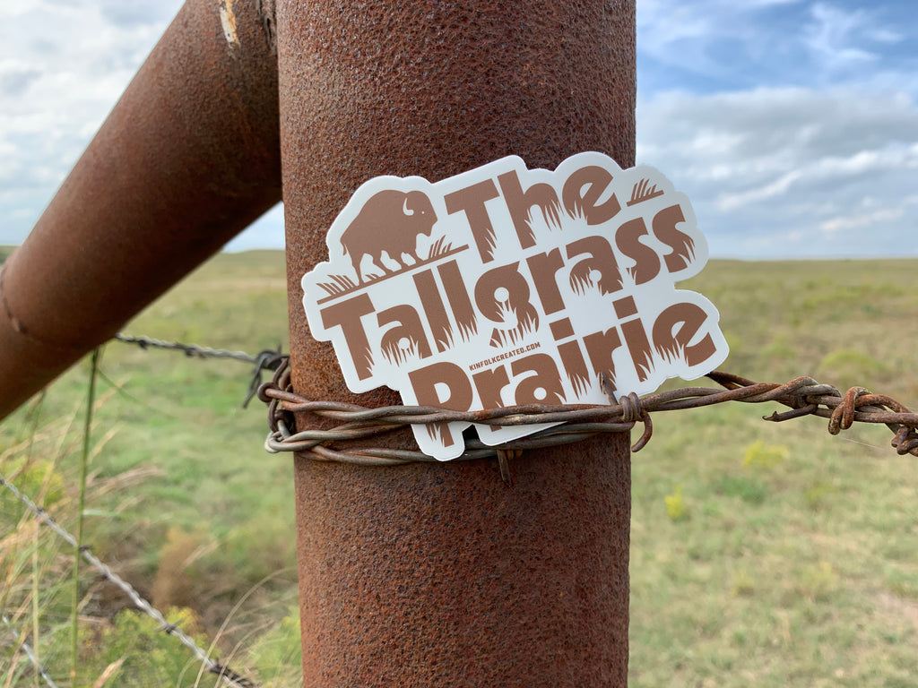 Tallgrass prairie sticker attached to a barbwire fence.